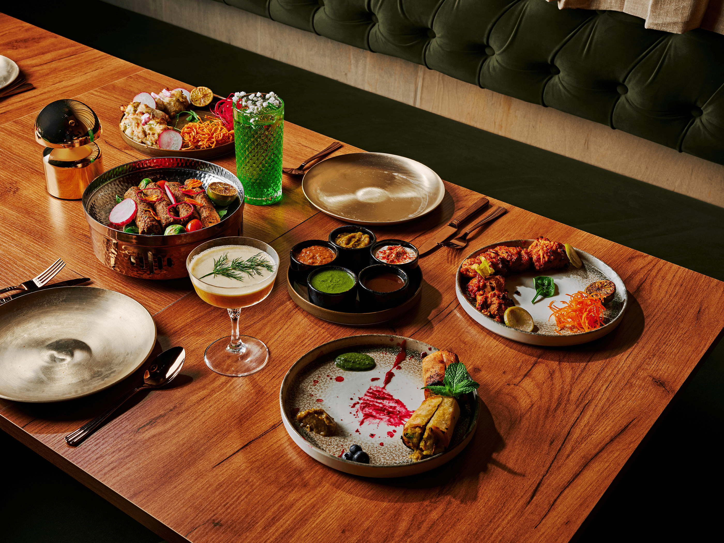 Ikara signature spread - cocktails and artfully plated dishes