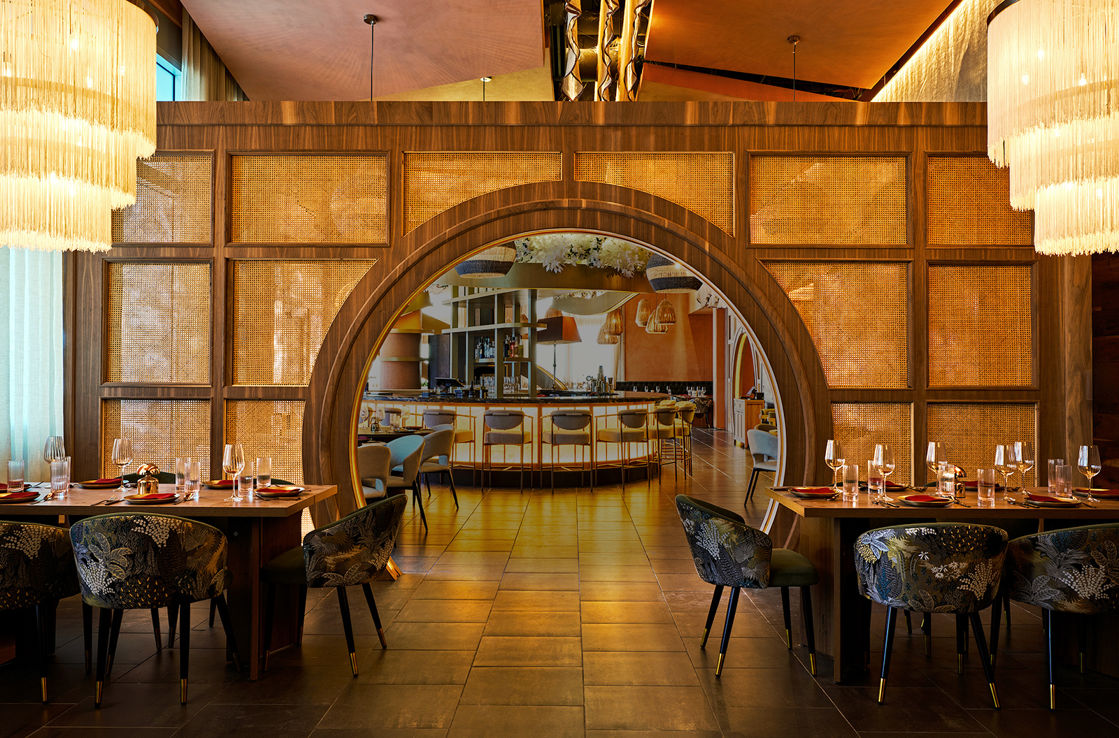 Ikara restaurant interior - warm ambient lighting over elegant dining tables